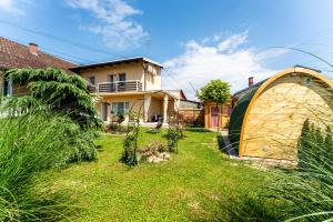 a house with a large yard with a gazebo at Studio apartman the little Prince in Bjelovar