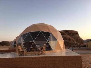 a dome tent in the middle of the desert at Wadi Rum Maracanã camp in Wadi Rum