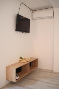 a living room with a tv on a wall at Cavleski apartment in Prilep