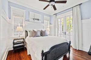 a bedroom with a bed and a ceiling fan at Our Happy Place in Santa Rosa Beach +49 photos