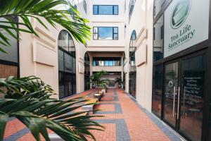 an empty street in a building with plants at Elements Hotel & Shops Curaçao in Willemstad