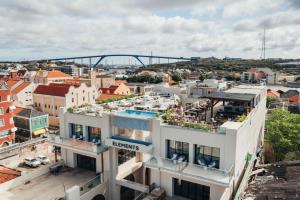 an apartment building with a view of a city at Elements Hotel & Shops Curaçao in Willemstad