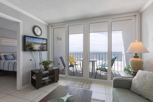 a living room with a view of the ocean at Island Shores 654 in Gulf Shores