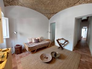 a living room with a couch and a table at Cosy Terrace House - design, comfort, micro-pool, top location in Olhão in Olhão