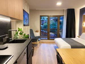 Voodi või voodid majutusasutuse Modern Blue Studio En Valle De Incles - Parking Gratis l by BonesVacances toas