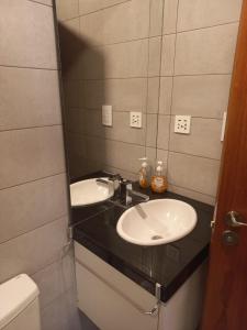 a bathroom with a sink and a toilet at PIHARE II in Santa Cruz de la Sierra
