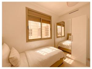 Postel nebo postele na pokoji v ubytování Appartement de luxe Al hoceima