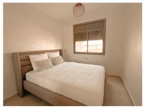 Postel nebo postele na pokoji v ubytování Appartement de luxe Al hoceima