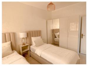 Postel nebo postele na pokoji v ubytování Appartement de luxe Al hoceima