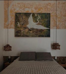 Ένα ή περισσότερα κρεβάτια σε δωμάτιο στο Guayabo estudio +3 φωτογραφίες