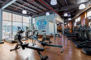 a gym with a bunch of treadms and cardio machines at Holiday Inn Kuwait by IHG in Kuwait