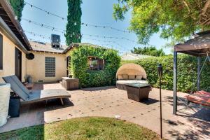 a patio with a bench and an arbor at Lake Balboa Home with Scenic Patio Near Van Nuys! in Van Nuys