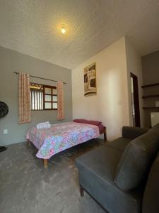 Giường trong phòng chung tại pousada valle das pedras