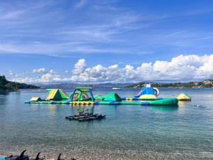 a row of inflatable water slides in the water at Attico "NIDO" a 50m dal mare con terrazzo grande - un'oasi di pace e bellezza in Nečujam