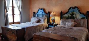 Postel nebo postele na pokoji v ubytování Villa Claus Inn + 3 fotografie