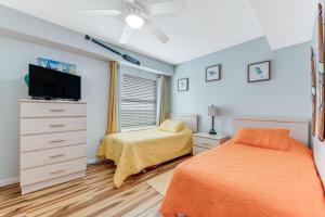 A bed or beds in a room at Updated Oceanfront Condo! Come Relax by the Sea!