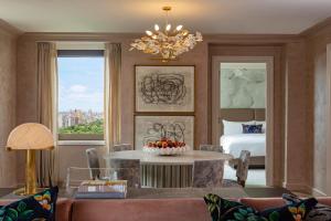 a room with a bed and a table with fruit on it at JW Marriott Essex House New York in New York