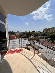 a balcony with a view of a city at ZIRICH PROPERTIES EAST LEGON in Accra