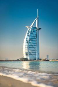a view of the burj al arab hotel from the beach at Loft Style Partition Room in Shared Apartment in Al Barsha 1 Near MOE Metro in Dubai