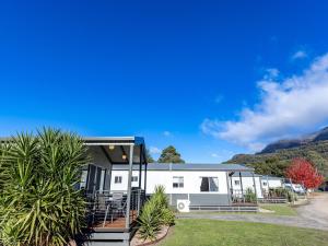 an rv with a mountain in the background at NRMA Halls Gap Holiday Park in Halls Gap