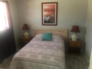 Voodi või voodid majutusasutuse Surfside Suites toas