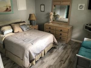 Voodi või voodid majutusasutuse Surfside Suites toas