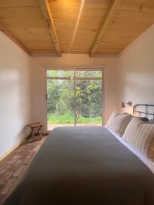 Postel nebo postele na pokoji v ubytování Rural Getaway: Rancho Chijilté
