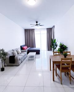 a living room with a couch and a table at Beacon2BR #InfinityPool #Georgetown #FamilyHoliday in George Town