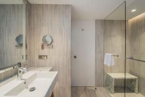 a bathroom with a sink and a shower at Sails in the Desert in Ayers Rock