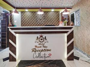 a restaurant reception counter with a sign that reads hotel world plaza resort collection at Collection O 47006 Hotel Magadh Palace in Dānāpur