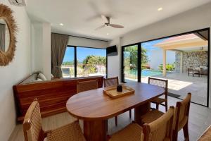 a dining room with a wooden table and chairs at Villa Marie, 2 Bedrooms, Lamai Koh Samui in Koh Samui 