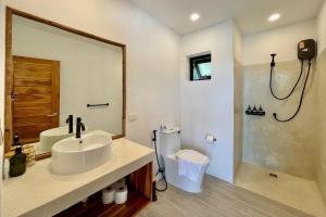 a white bathroom with a sink and a shower at Villa Marie, 2 Bedrooms, Lamai Koh Samui in Koh Samui  +20 photos