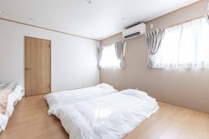 PEACE OF REST SHIRAHAMA客房内的一张或多张床位