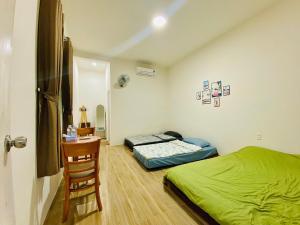 Giường trong phòng chung tại Mộc Lam Homestay