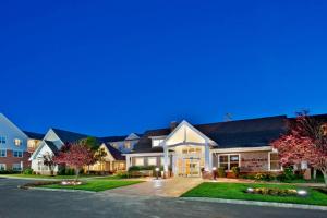 a large house with a driveway at night at Residence Inn Bridgewater Branchburg in Branchburg Park