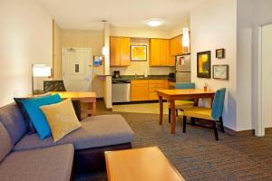 a living room with a couch and a table at Residence Inn Bridgewater Branchburg in Branchburg Park