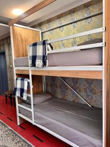 a couple of bunk beds in a room at InJoy in Shymkent