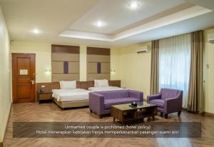 Postel nebo postele na pokoji v ubytování Hotel Alia Cikini