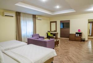 Postel nebo postele na pokoji v ubytování Hotel Alia Cikini