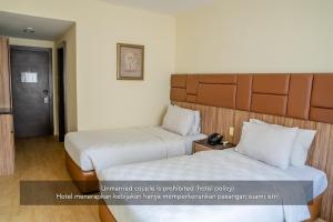 Postel nebo postele na pokoji v ubytování Hotel Alia Cikini
