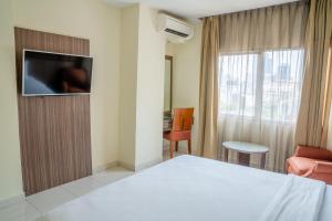 Postel nebo postele na pokoji v ubytování Hotel Alia Cikini