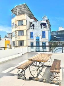 a picnic table on the roof of a building at Cassie Boutique Hotel in Vung Tau