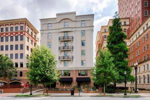 a tall white building in the middle of buildings at Residence Inn Atlanta Midtown 17th Street in Atlanta