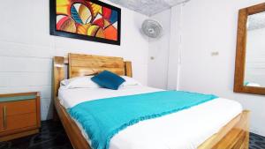 Postel nebo postele na pokoji v ubytování Hostal Vista Hermosa