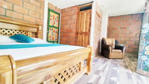 Postel nebo postele na pokoji v ubytování Hostal Vista Hermosa