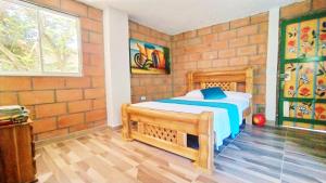 Postel nebo postele na pokoji v ubytování Hostal Vista Hermosa