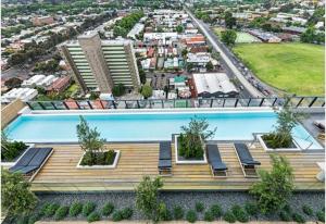 an overhead view of a building with a swimming pool at 1 BEDROOM STUNNING VIEW APARTMENT in Melbourne