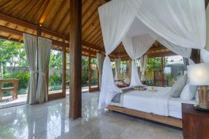 Ένα ή περισσότερα κρεβάτια σε δωμάτιο στο Kabinawa Ubud Villas by GenuineHost +36 φωτογραφίες