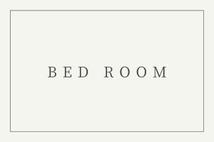 白浜町にあるAzami Ann Maisonetteの赤字の寝室写真