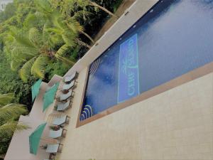 a large billboard on the side of a building with umbrellas at Cerf Island Resort in Cerf Island